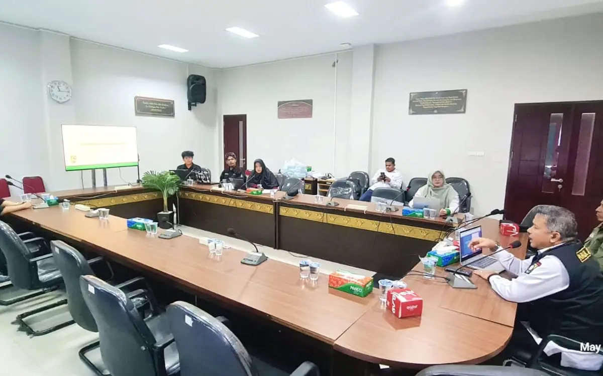 Presenting the rebuilt village website in the village meeting
                room, with the site projected on screen.